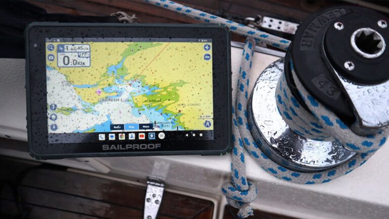 SailProof SP10X tablet next to a winch during a rainy sailing session, with water droplets on the screen.